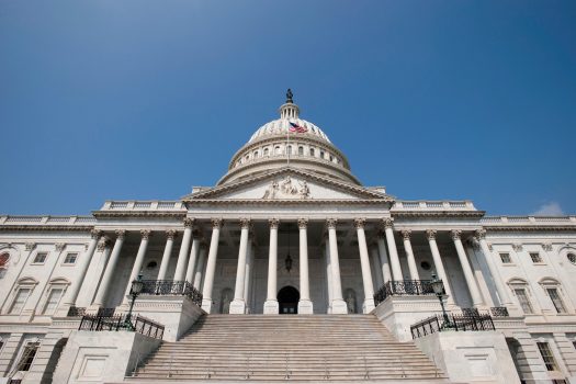East Steps of the US Capitol from the ground with a clear blue sky