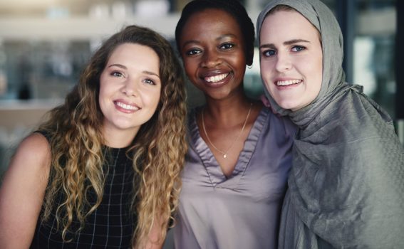 Portrait of a group of confident young businesswomen working together in a modern office