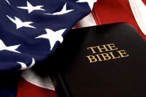 Photo of American flag with a bible