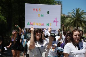 ORLANDO, FLORIDA - APRIL 13: People walk together during a “Rally to Stop the Six-Week Abortion Ban” held at Lake Eola Park on April 13, 2024 in Orlando, Florida. The rally organized by the Yes On 4 campaign is in response to the Florida Supreme Court's recent ruling that the State Constitution’s privacy protections do not extend to abortion, effectively allowing Florida to ban the procedure after six weeks of pregnancy. The justices will allow Florida voters to decide in the November election if they want to expand abortion access.