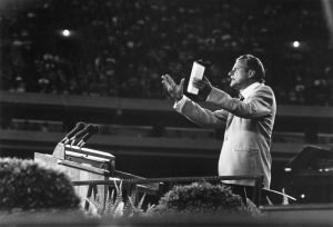 circa 1955: US evangelist Billy Graham addressing a meeting.
