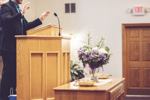 View of a pastor preaching on the pulpit in the church A view of a pastor preaching on the pulpit in the church