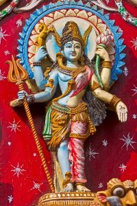 Shri Ardhanarishwara (literally Half-Woman God), traditional image of Parvati and Shiva in one body. Image on the wall of ancient Kali temple in Puri, Orissa