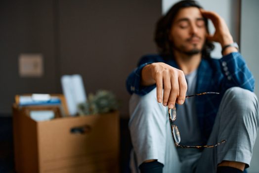 Close up of worried businessman gets fired at work. Copy space.
