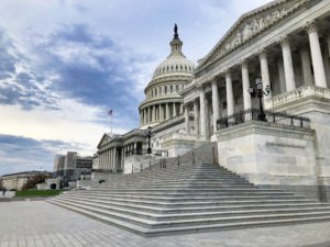 Picture of the US Capitol building on a partly cloudy day